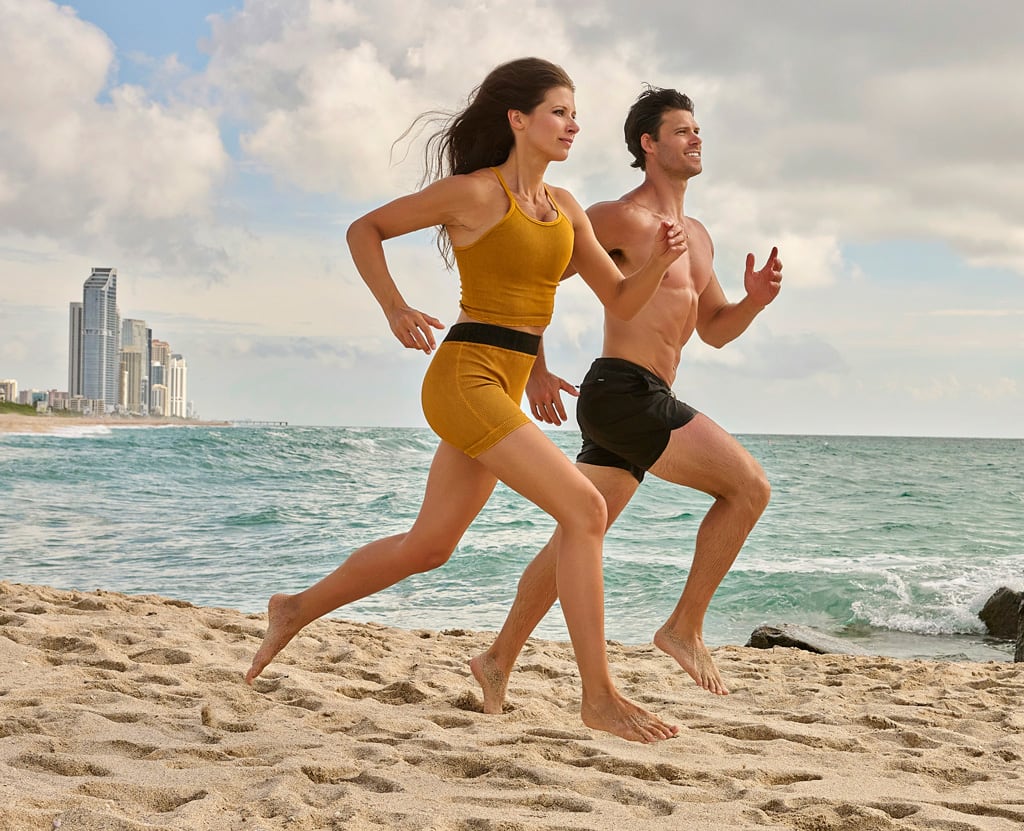 Coaches are running on the beach.